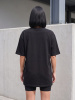 Woman_wearing_black_t-shirt_shorts_202607030926
